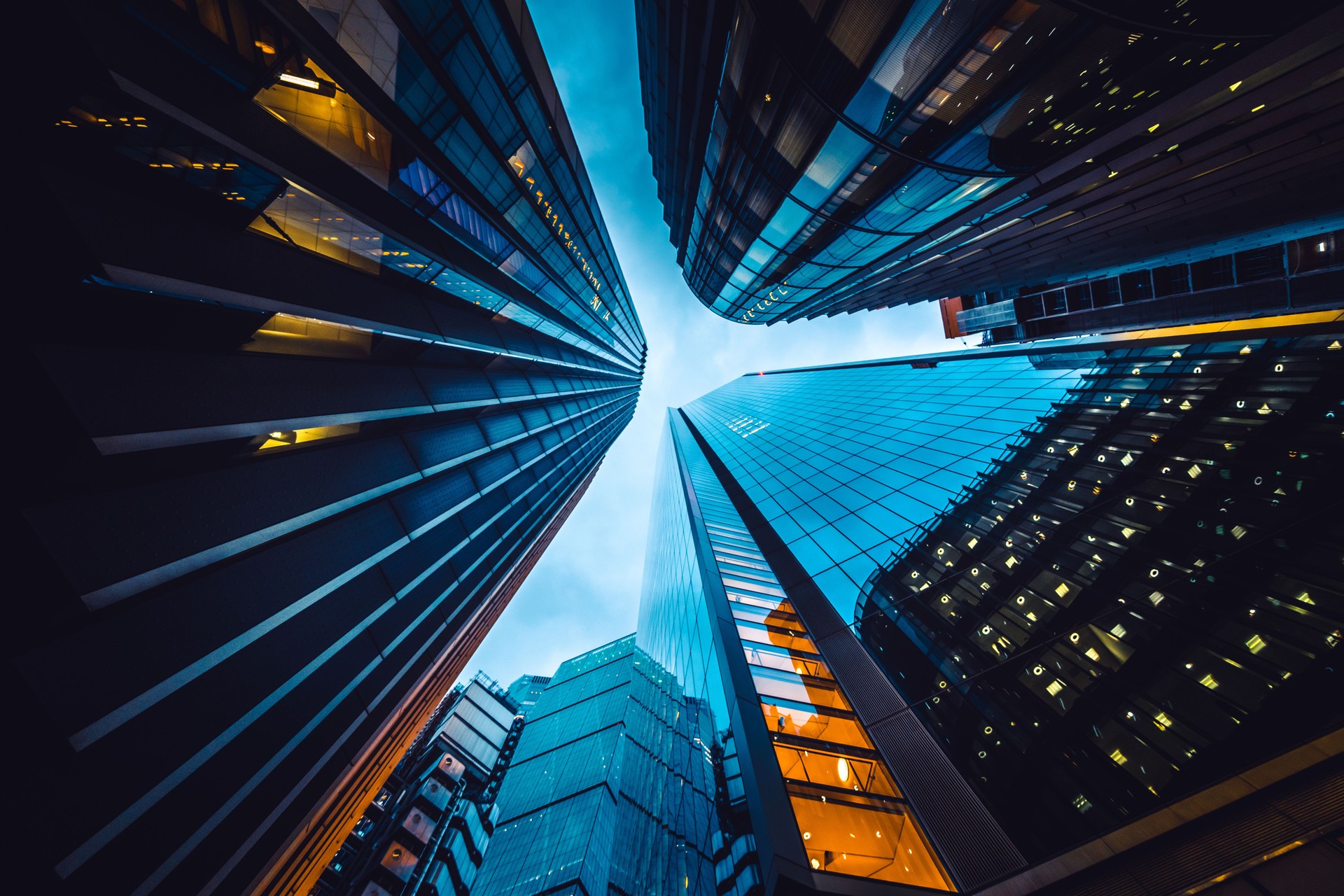 Looking directly up at the skyline of the financial district in central London